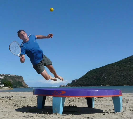 In the new racquet game of 360ball, players hit a ball into a central concave dish, trying to rebound it out of the reach of their opponents