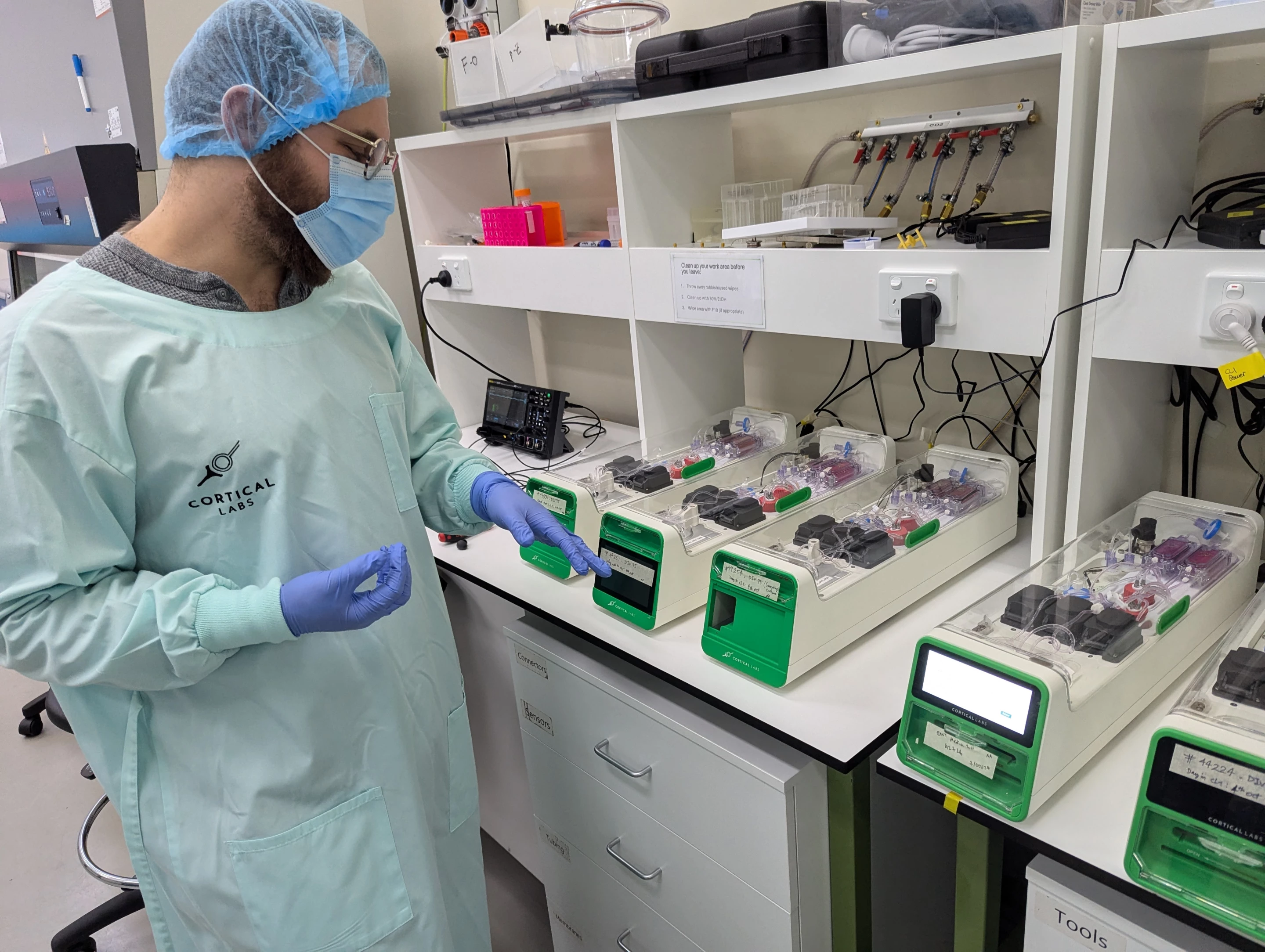 Kagan and team testing the CL1 units, which are built to maintain the health of the cells living on the silicon hardware