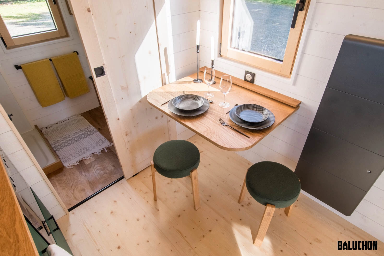 The Midgard's kitchen includes a small dining table that folds away when not in use