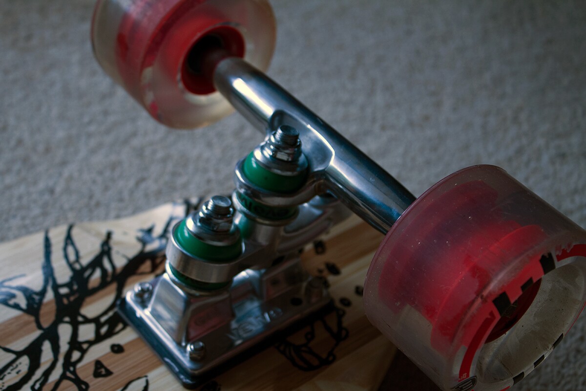 The Evolve electric skateboard's custom dual trucks