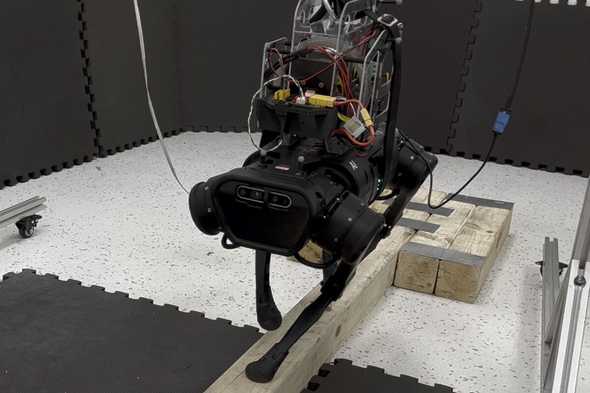 The Unitree A1 quadruped robot utilizes two reaction wheel actuators (RWAs) to maintain its balance, regardless of which of its feet are in contact with the beam