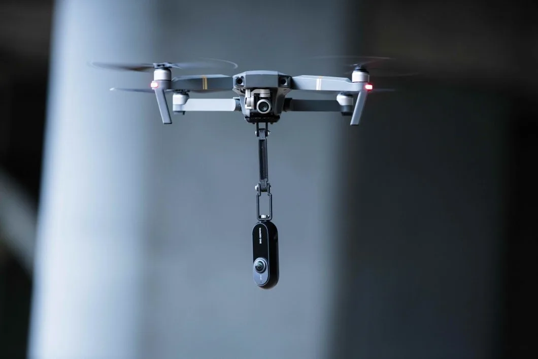 The Insta360 One camera dangling from a drone