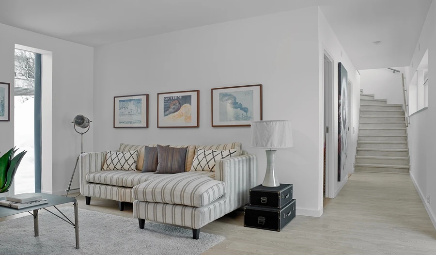 On the lower level of the house there are three additional bedrooms, a family room, a bathroom an outdoor terrace that leads to the lower garden