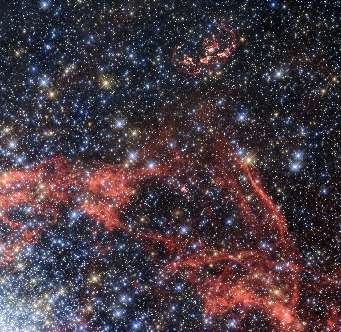 The orange-red filaments visible in the image show the shock fronts of a supernova explosion