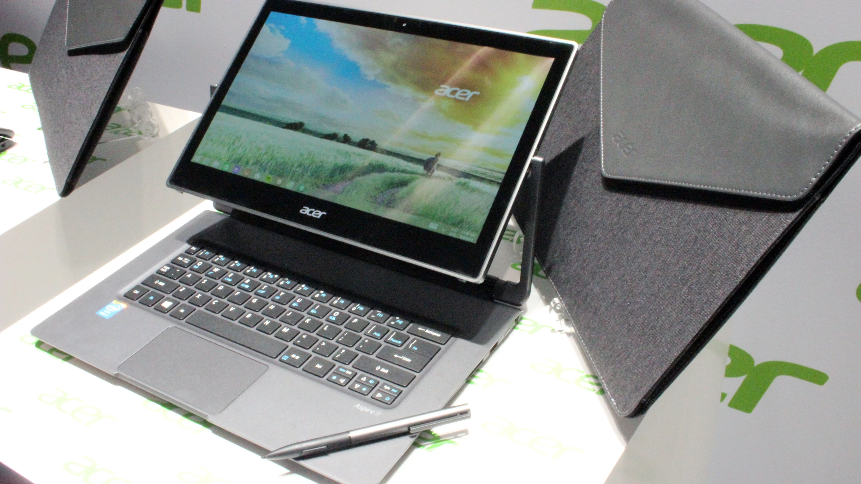 The R13's screen flips via a central hinge