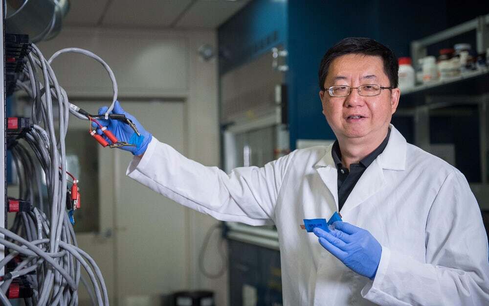 Dr. Kang Xu from the Army Research Laboratory with a saltwater battery developed in his lab
