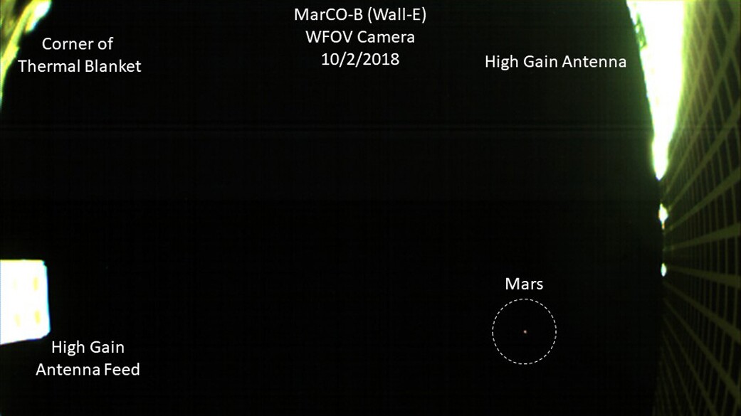 An annotated version of the Mars photo, showing the Red Planet as well as the instruments that are photobombing the shot
