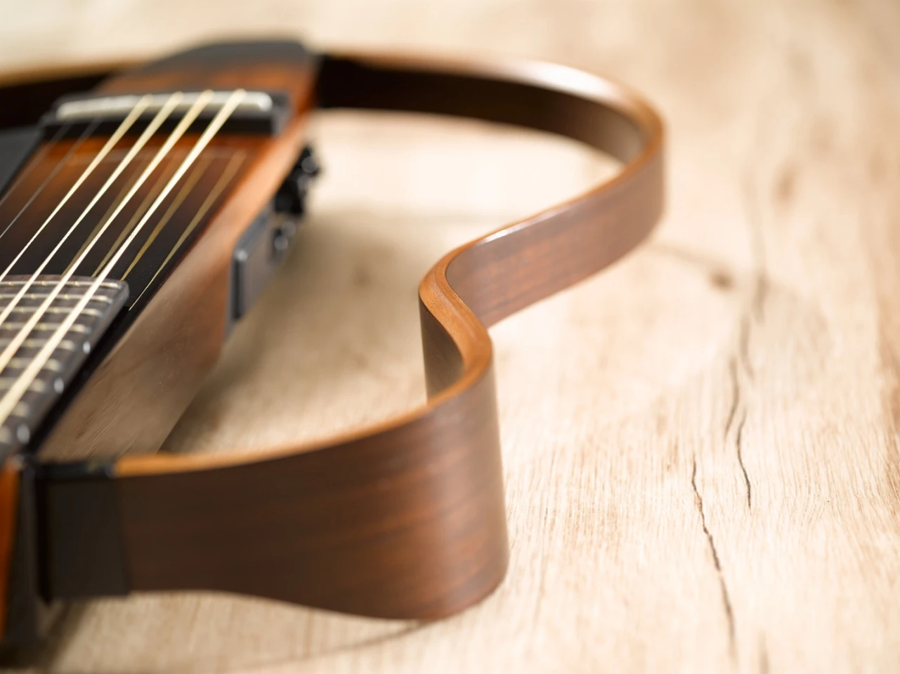 The SLG200 series Silent Guitars feature an all-new collapsible rosewood and maple frame and a mahogany body with a new modernized shape