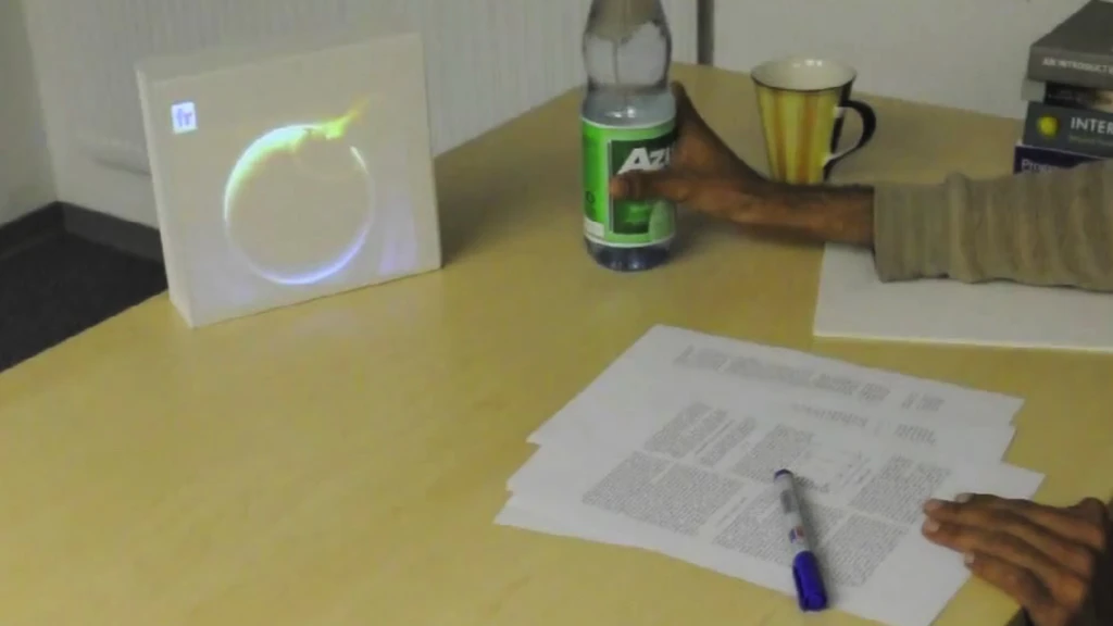 LightBeam allows physical objects, such as a water bottle, to act as a control for the pico projector