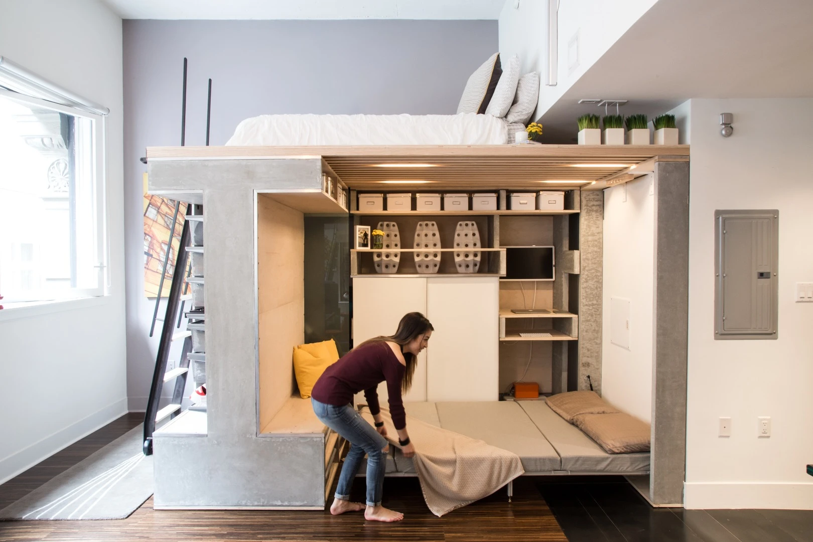 When deployed, the fold-down bed fills the lower-level space below the master sleeping area