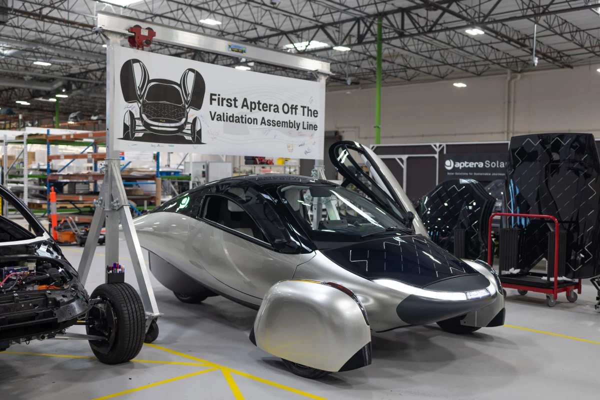 The banner says it all: The Aptera Solar EV has now moved from hand-built validation vehicles to structured assembly line production