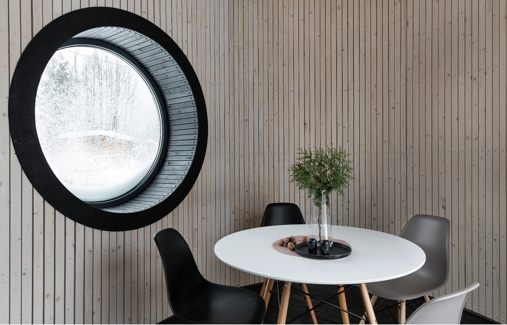 The Flexse prototype features a boat-like interior, with wooden carpentry throughout and a large round porthole window