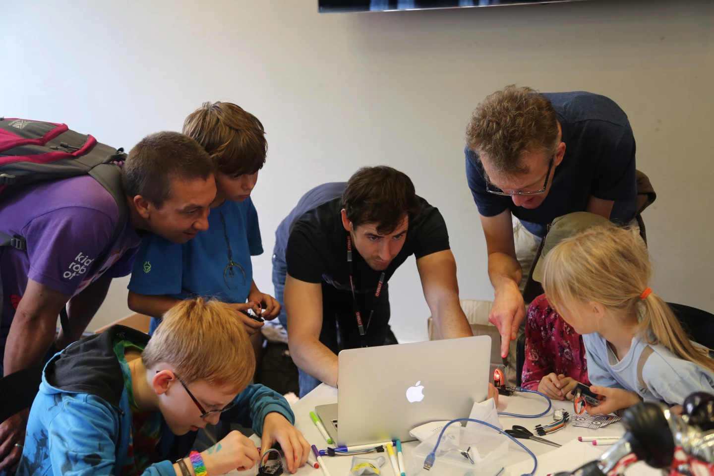 Maker Club members teaching kids to code and build robots
