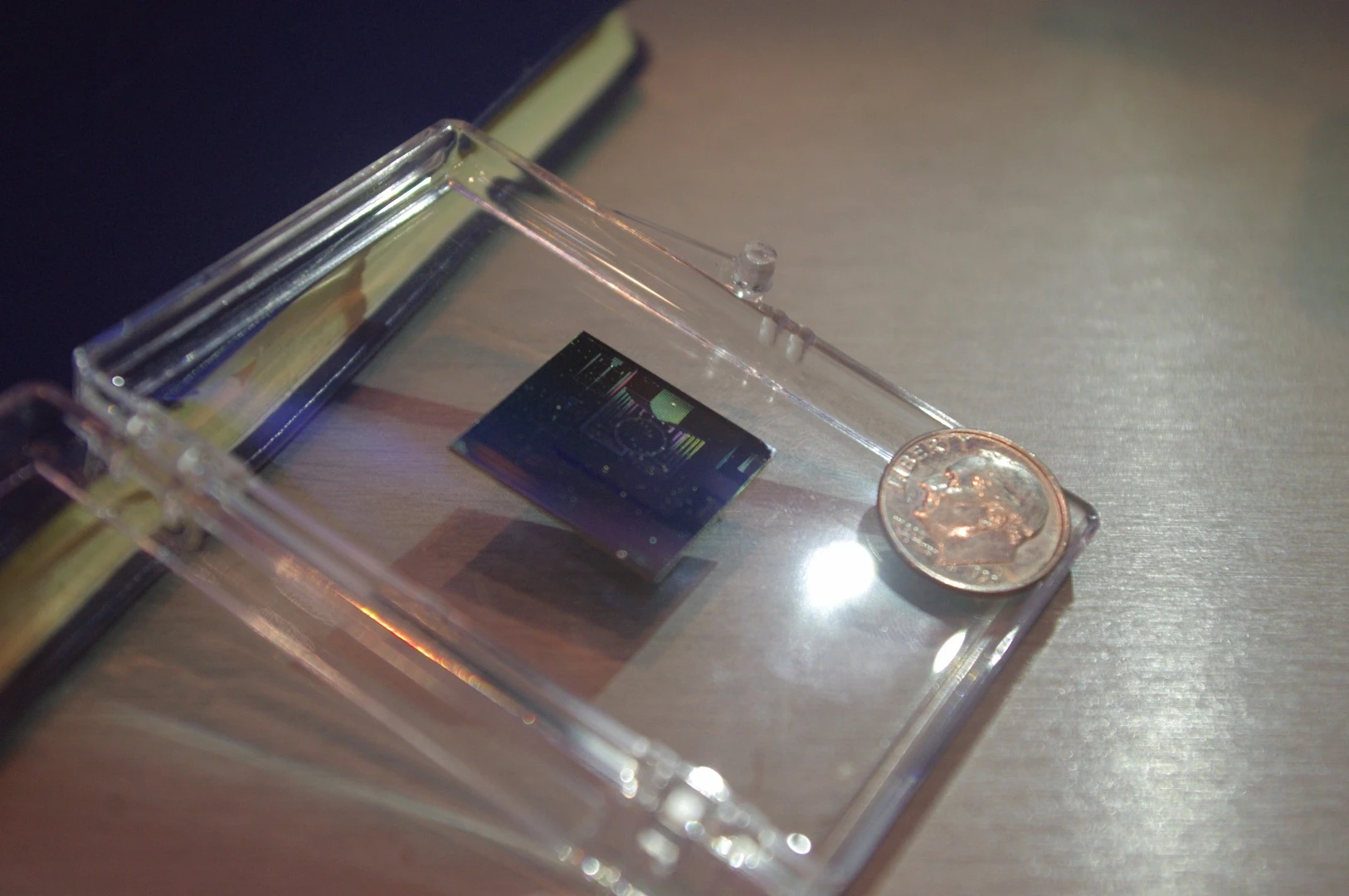 One of the SPIDER sensors from Lockheed Martin with a dime for scale