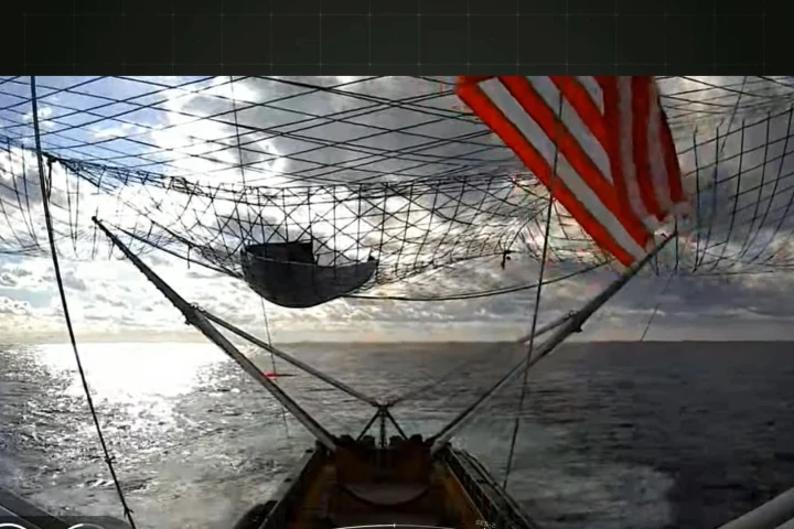 A screen grab showing a rocket fairing recovered by a SpaceX ship during an earlier mission