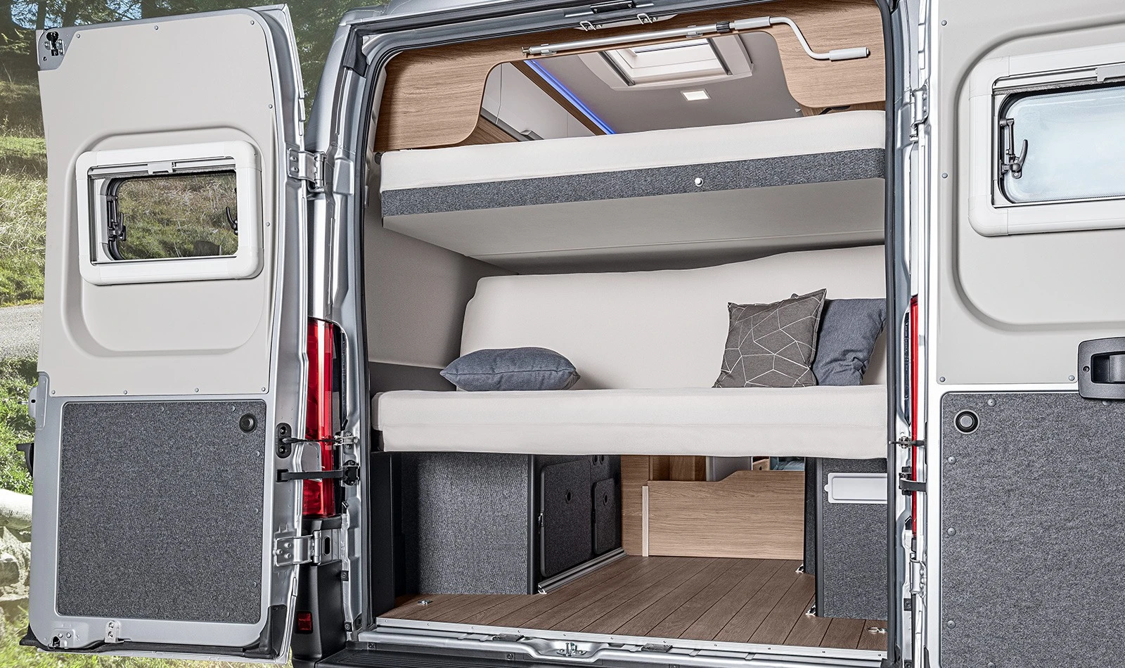 The Boxlife's available lower rear bed can convert to a scenic couch