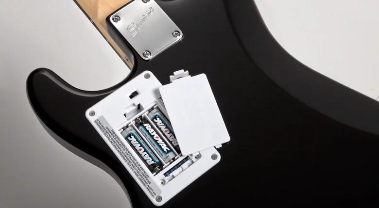 The battery compartment which powers the device is at the back of the guitar's body
