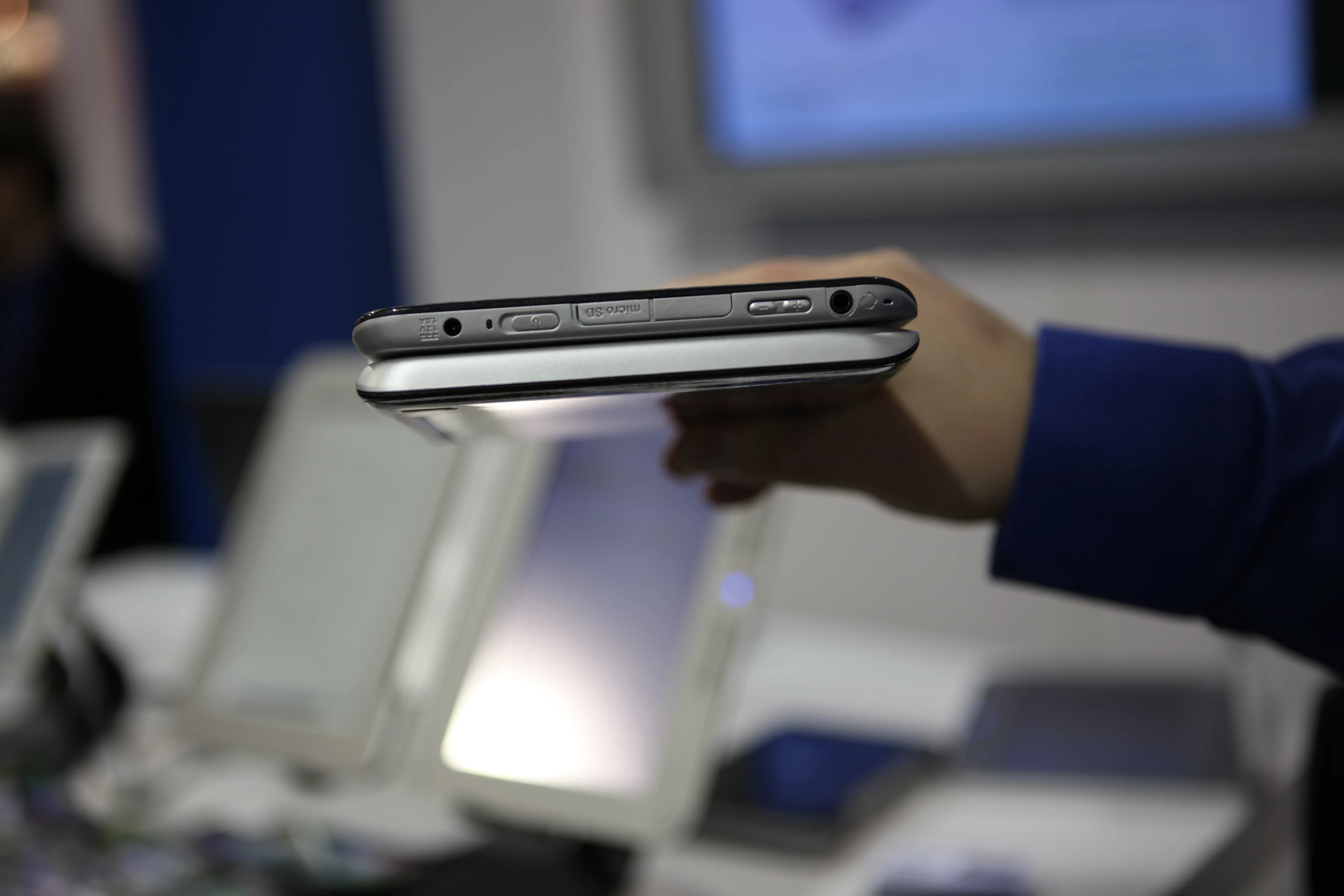 The top edge, showing headphone jack, power button and card slot