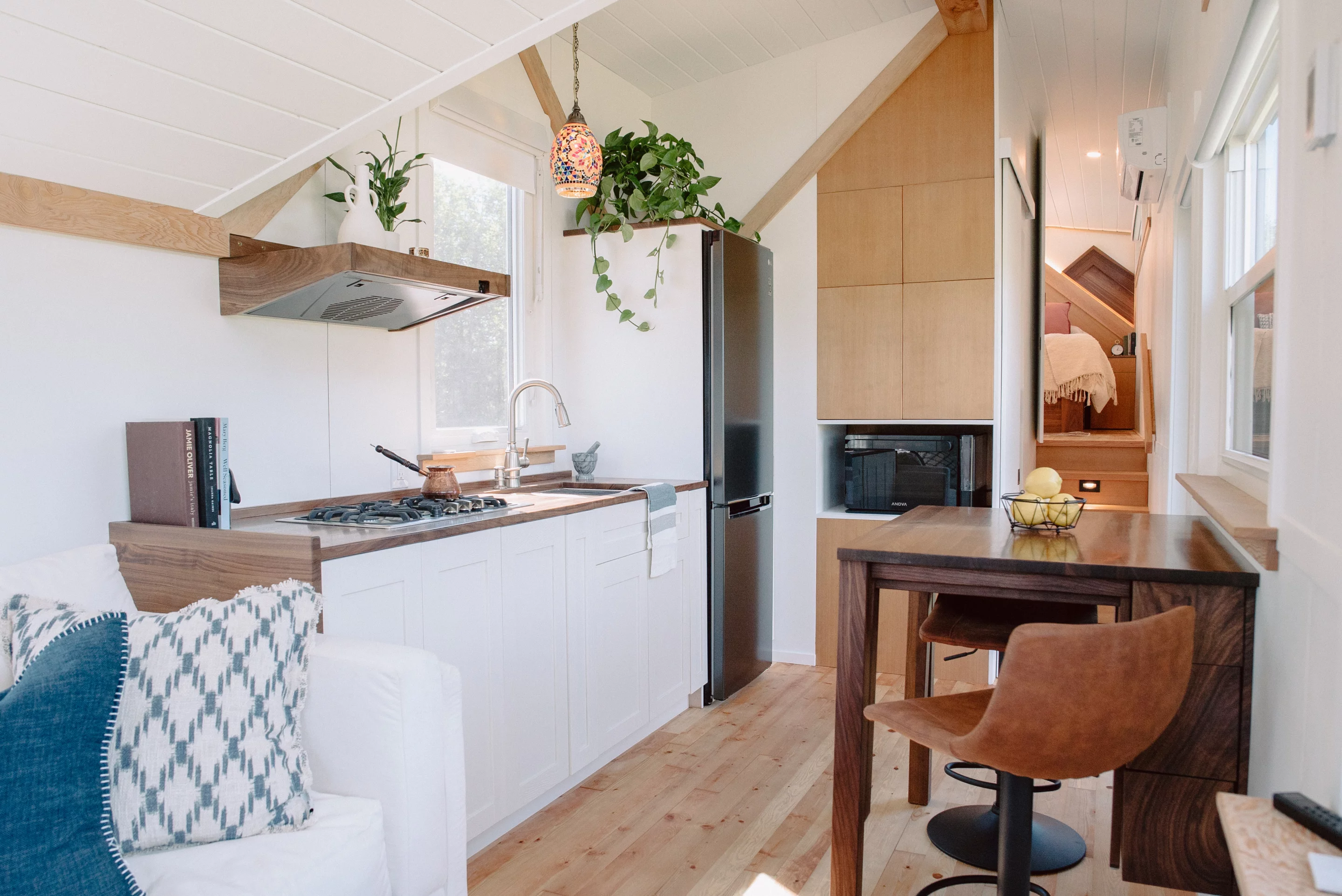 The Macdonald tiny house's kitchen area includes a table that will be used for dining and card games