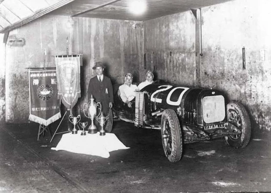 Honda's first racing experience was as a passenfger mechanic - that's him in the centre