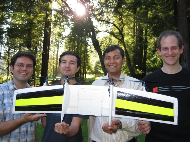 The Quadshot team and one of their prototypes