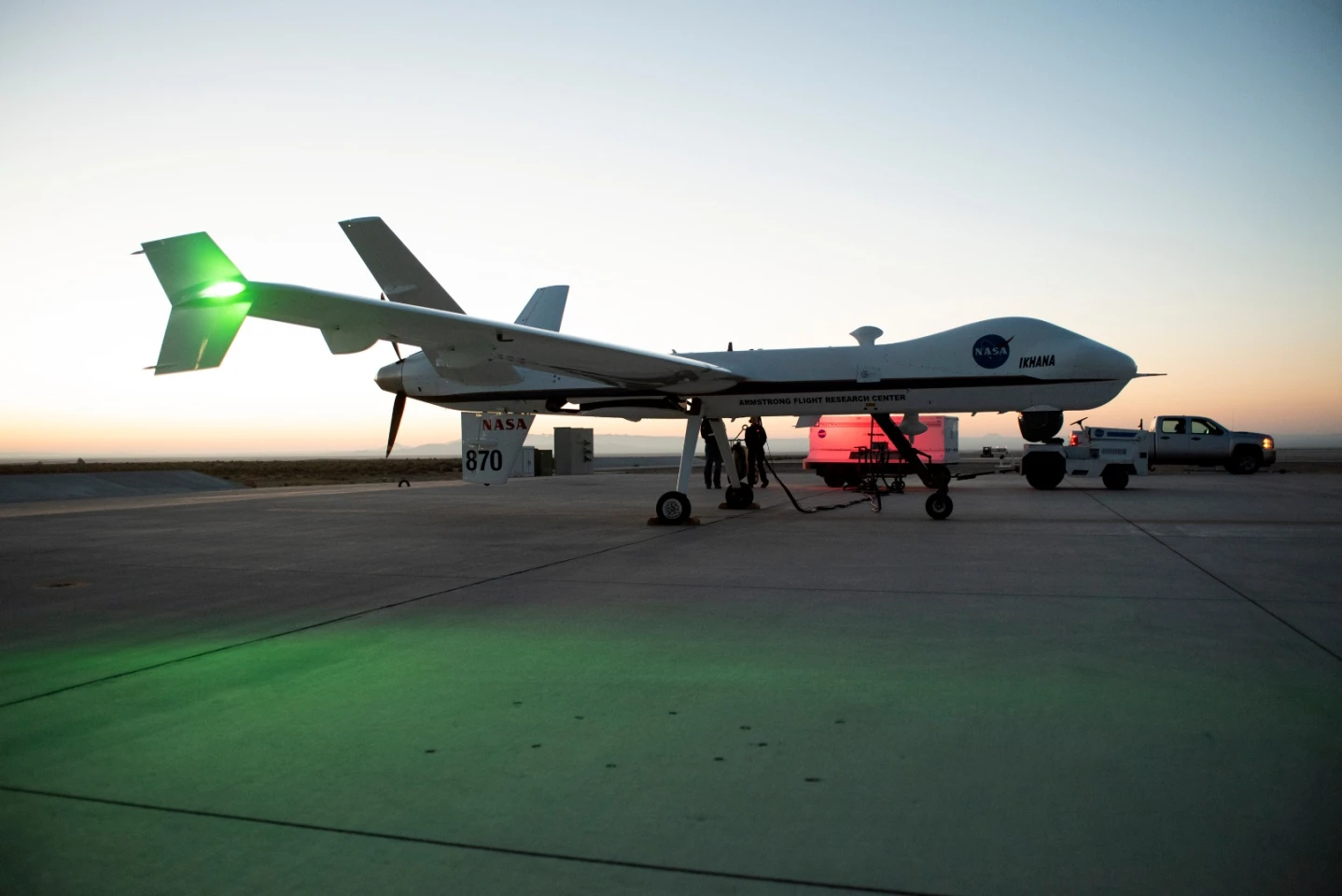 Aircraft maintenance crews at NASA‘s Armstrong Flight Research Center prepare the remotely-piloted Ikhana aircraft for a test flight June 12, 2018