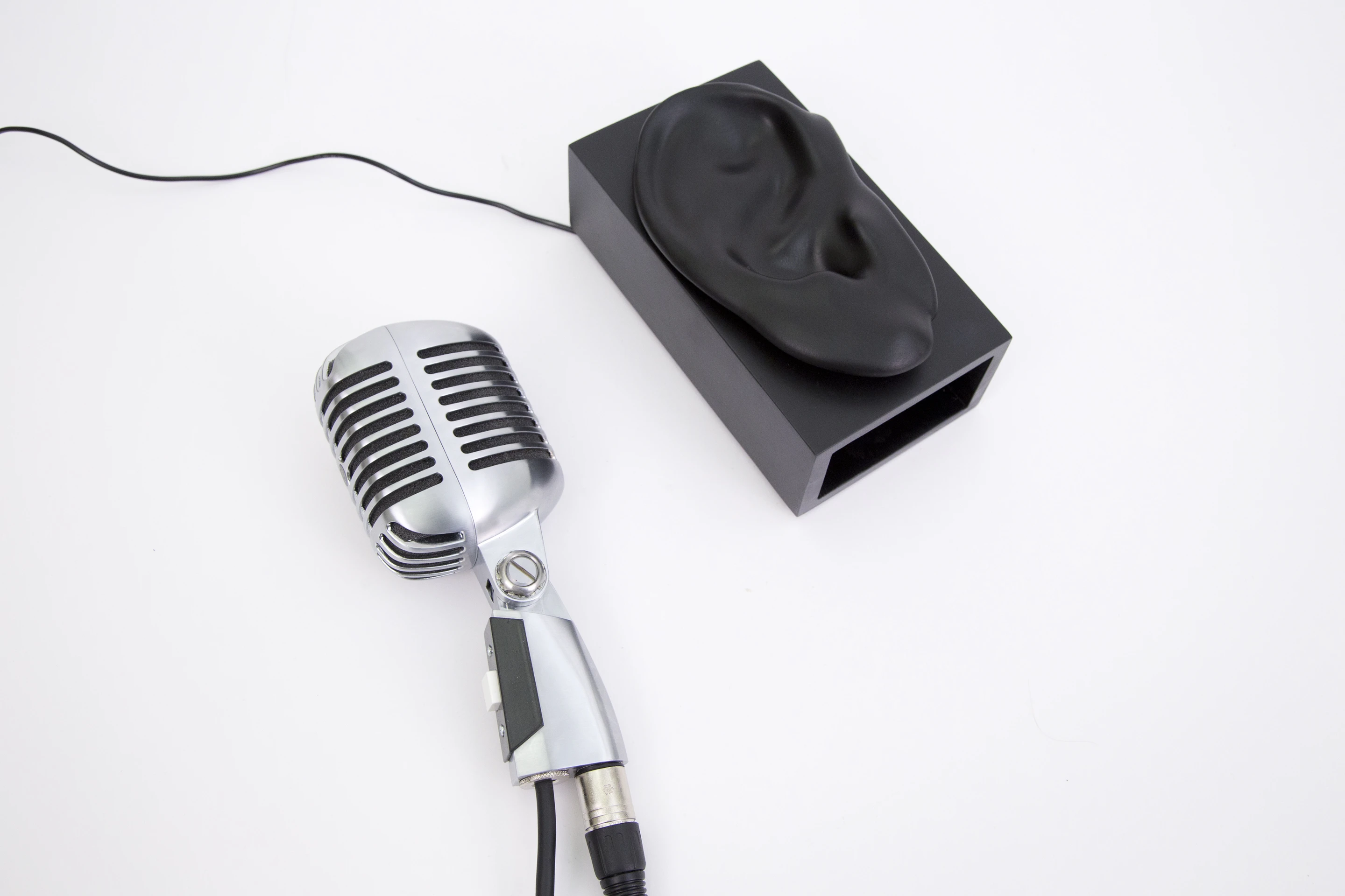 A microphone is connected to a computer’s sound card and instrumented with a custom button (Photo: Disney Research)