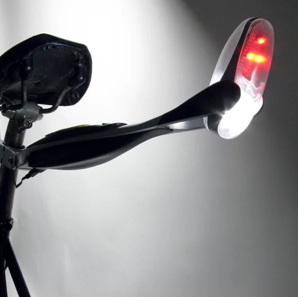 The Firefly bicycle light shines brightly on cyclists' backs and the road beneath their wheels when traffic approaches to provide greater visibility to motorists