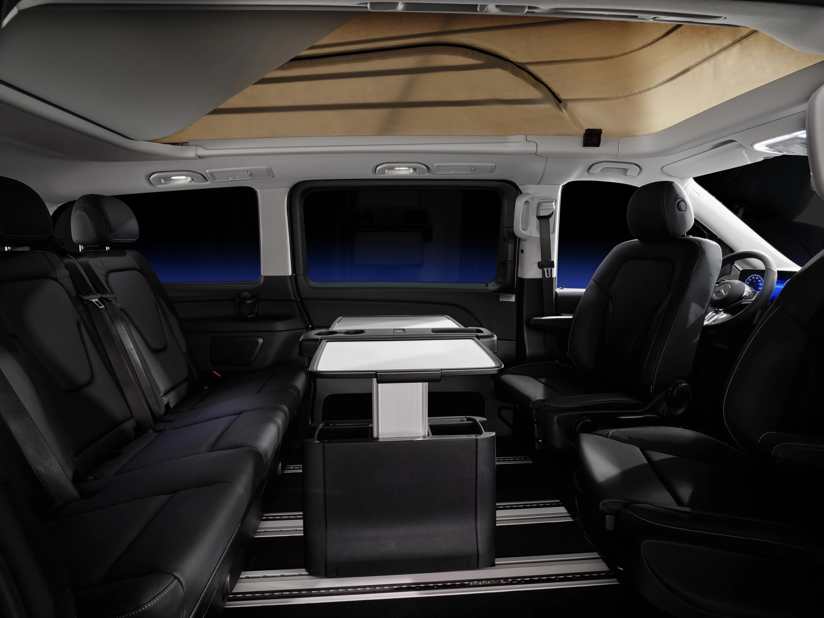 The available table mounts to the floor rails to create an interior ready for dining, laptop work and game play