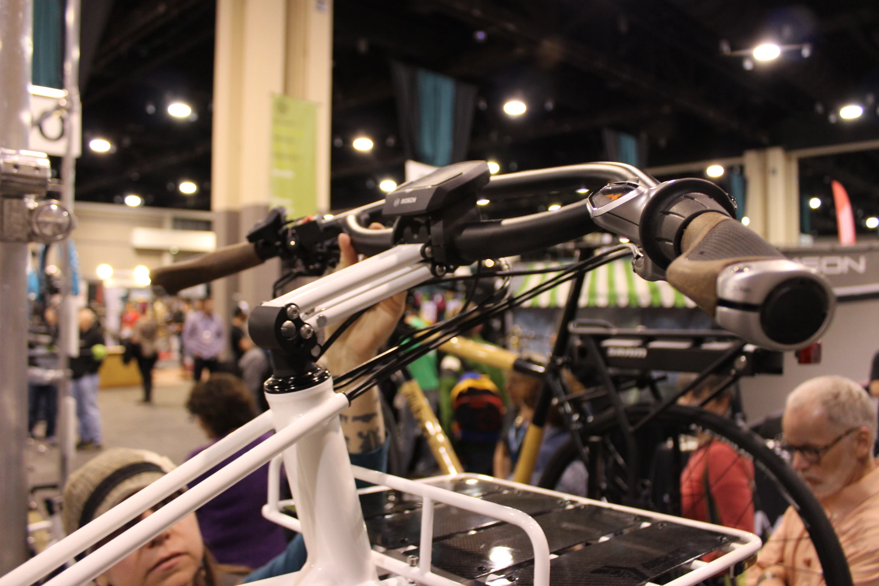 English Cycles made this hinged parallelogram stem, that can be raised and lowered to accommodate different sizes of riders