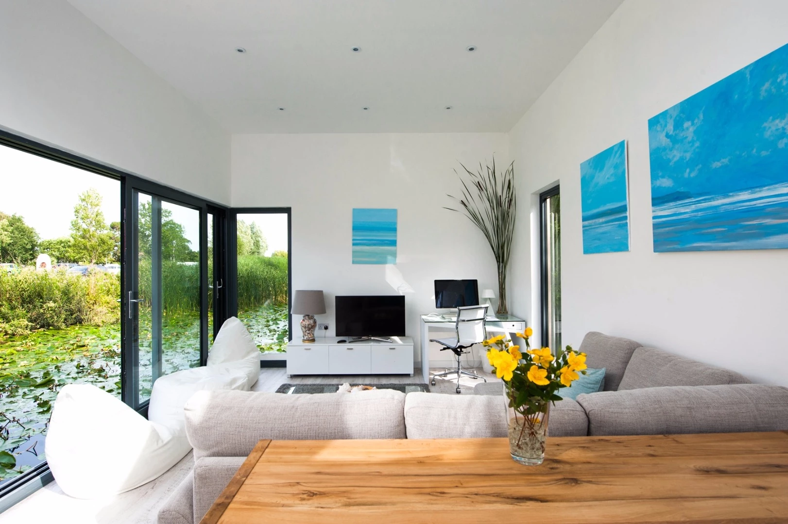 Inside, the Chichester floating home has a kitchen/ dining space, a living room, a bedroom, a bathroom and storage space