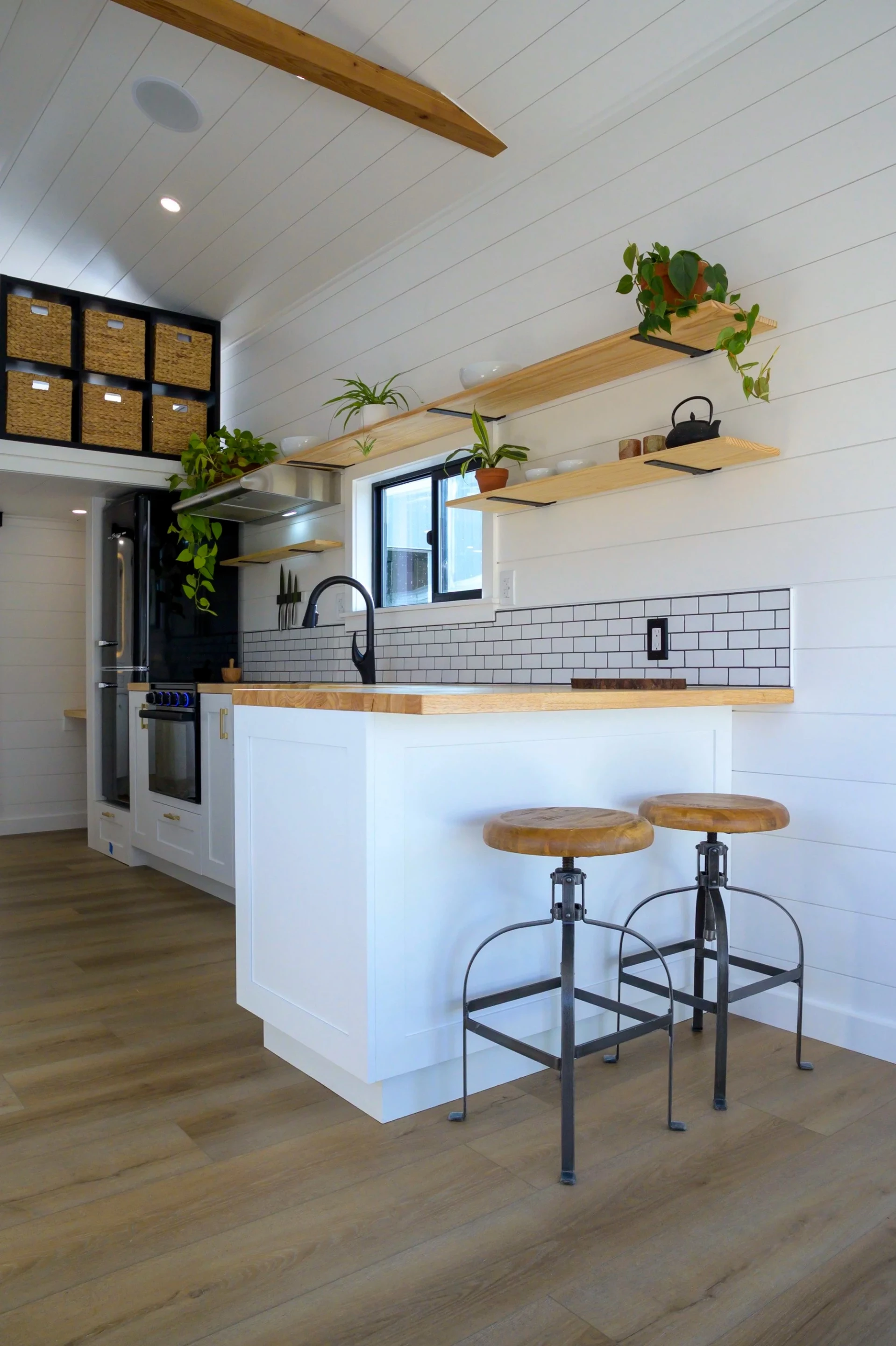 The Ochoco's kitchen features a breakfast bar seating area for two