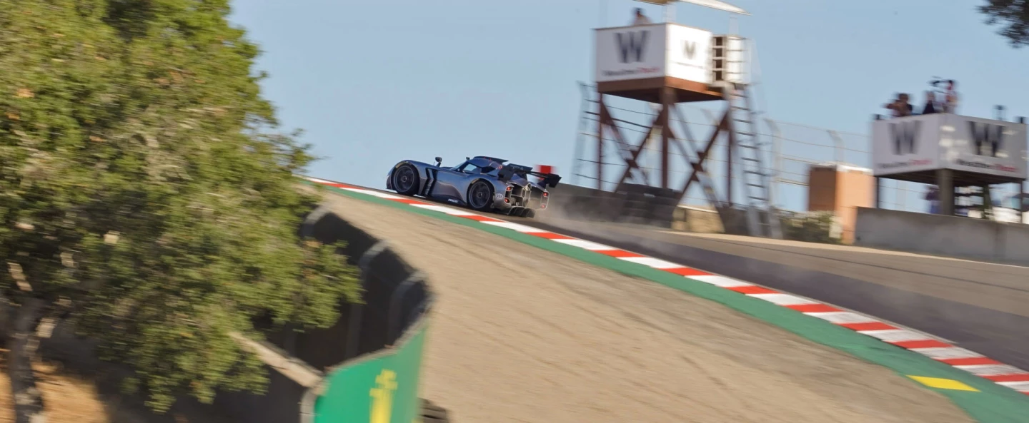 The McMurtry Spéirling electric fan car at the top of the Corkscrew, blowing debris everywhere