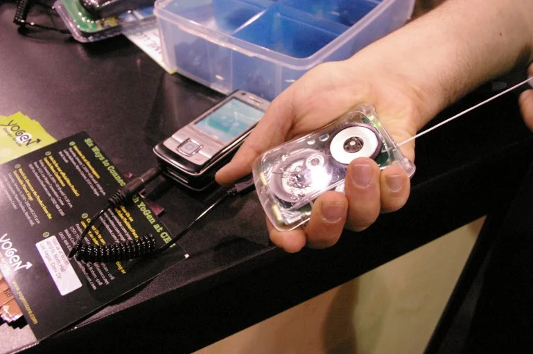 The YoGen charger shown here at CES 2010, uses your energy to power the batteries of most portable electronic devices