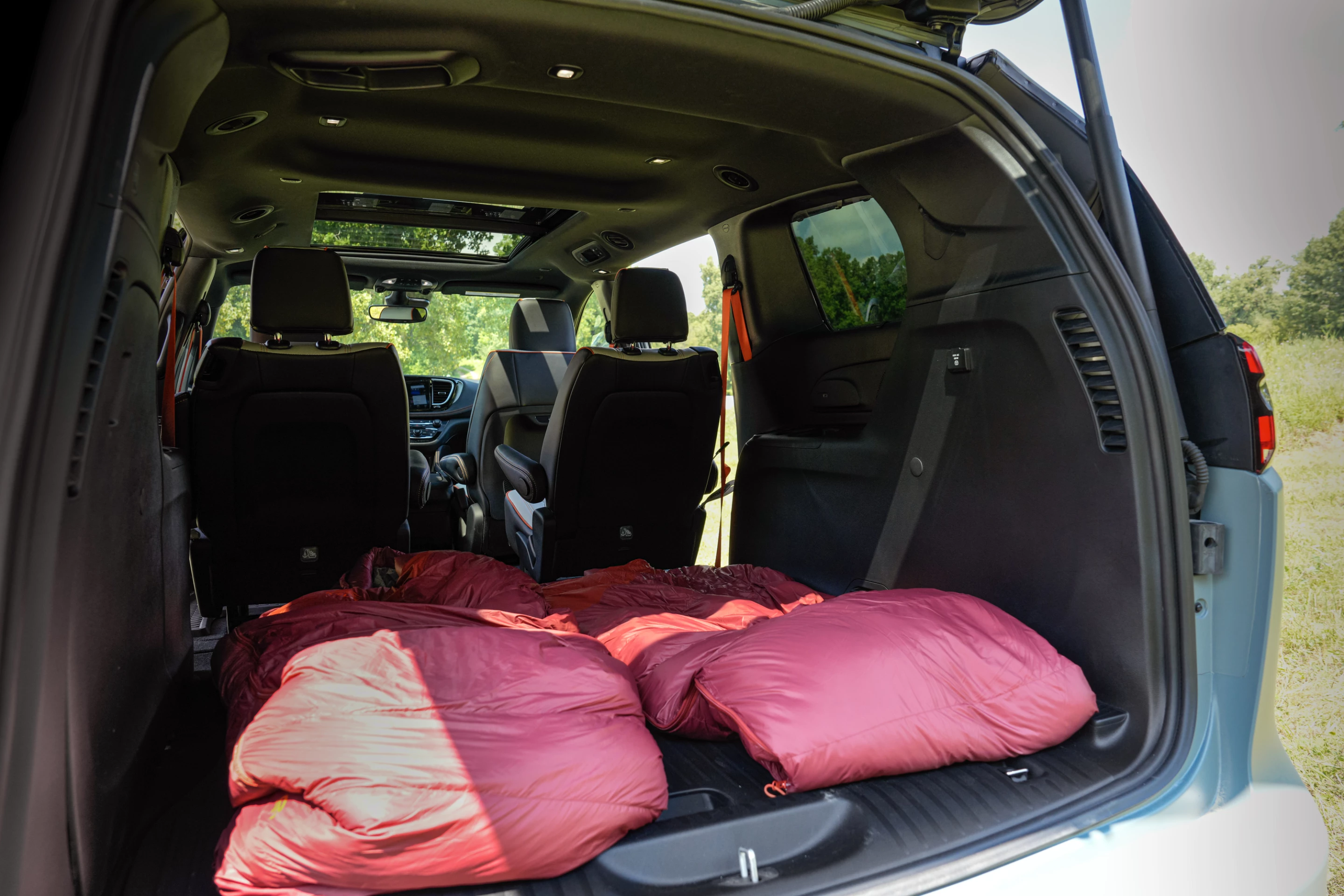 It looks a little tight here, but Pacifica solutions like removable/Stow-and-Go flat-store second-row seating can extend the sleeping area