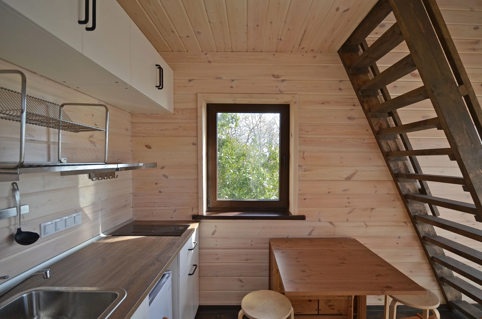 The S22's kitchen includes sink and two-burner induction hob