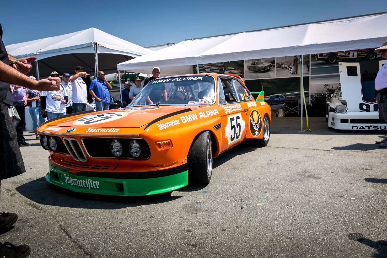 Liveried in classic Jagermeister orange, a race-prepped BMW CSL 3.0 backs it up