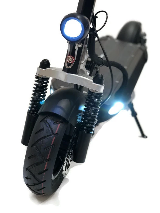 The eMove Cruiser has a headlight and deck-integrated lighting, rides on 10 inch pneumatic tires and features dual suspension