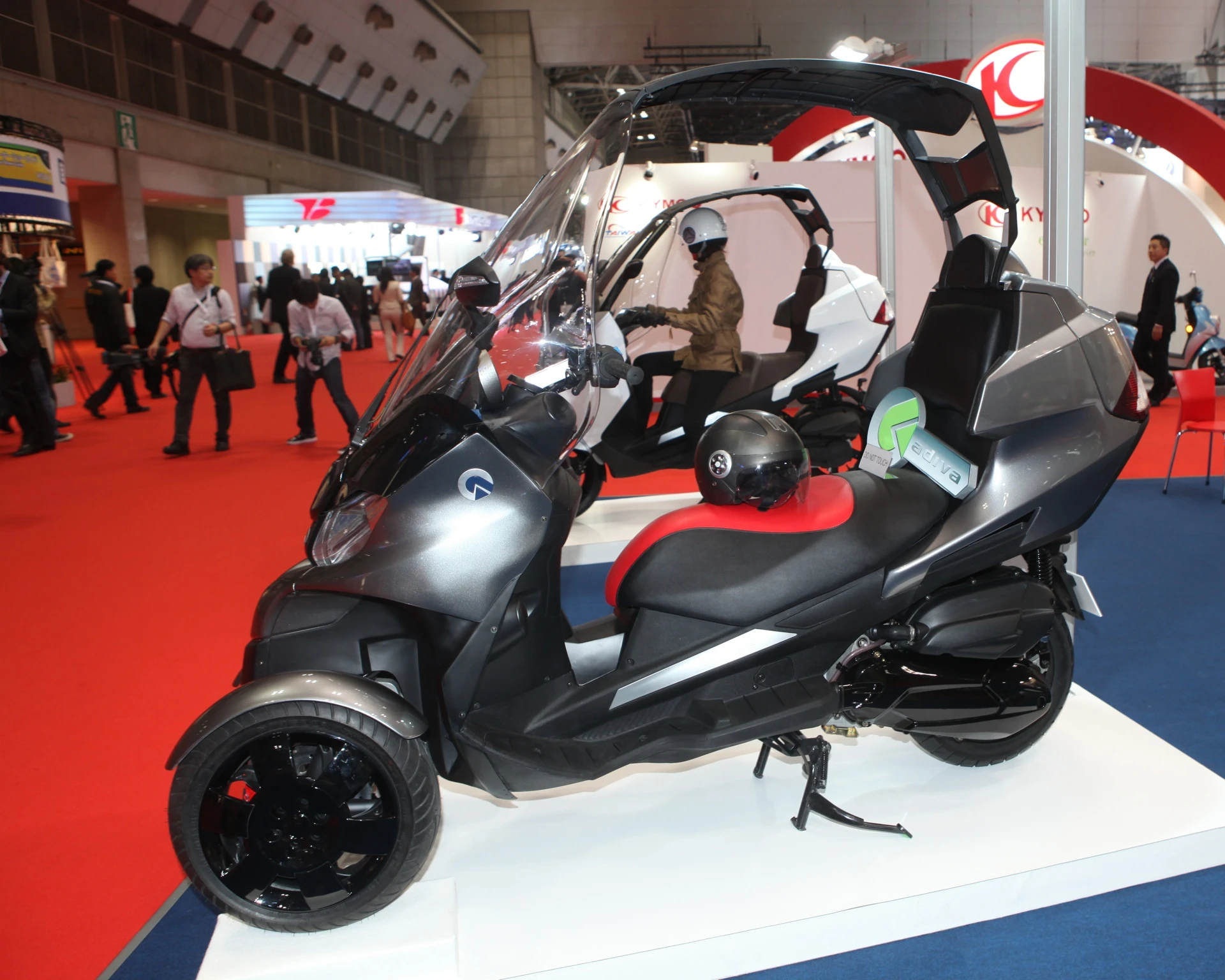 The Adiva AD3 three-wheeler (two front, one rear) scooter