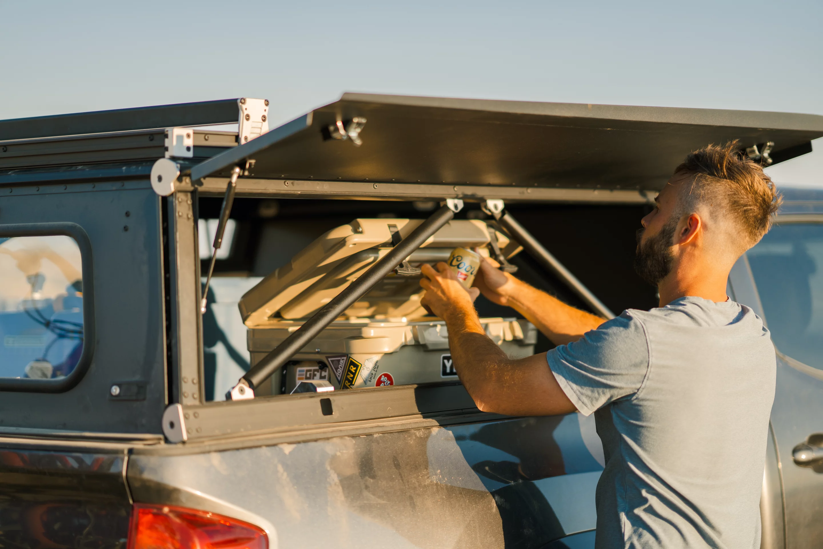Using the Platform Topper's side hatch to get a quick start on the backcountry "banquet"