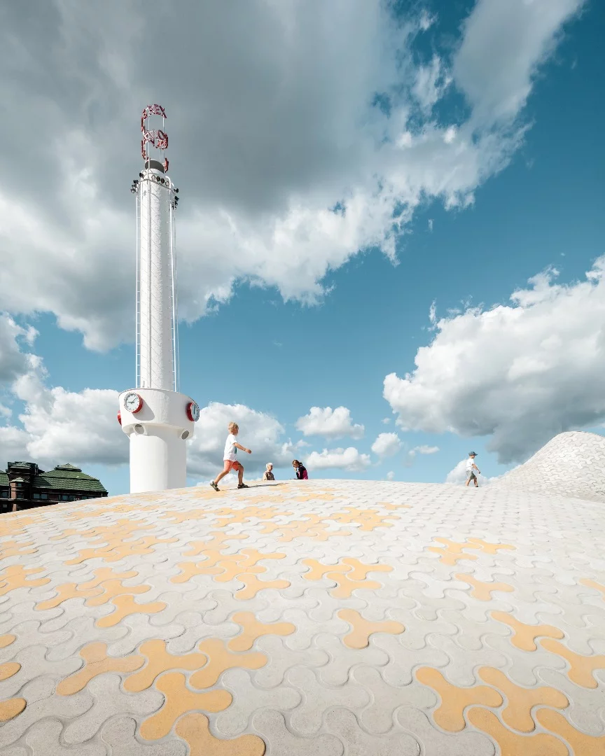 Children play on top of the renovated Lasipalatsi Square in Helsinki