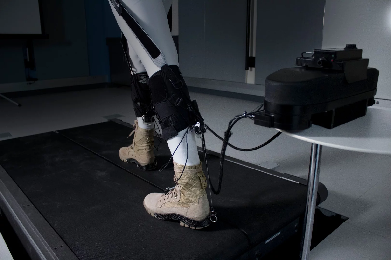 The system consists of functional textiles, cable-based actuation and a control system that take its cues from the user's individual walking mechanics