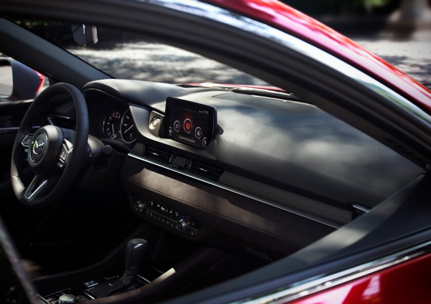 The 2018 Mazda6's interior appears to see some refinement to the middle dashboard strip, which now has a more straight-lined, full-length band across the interior