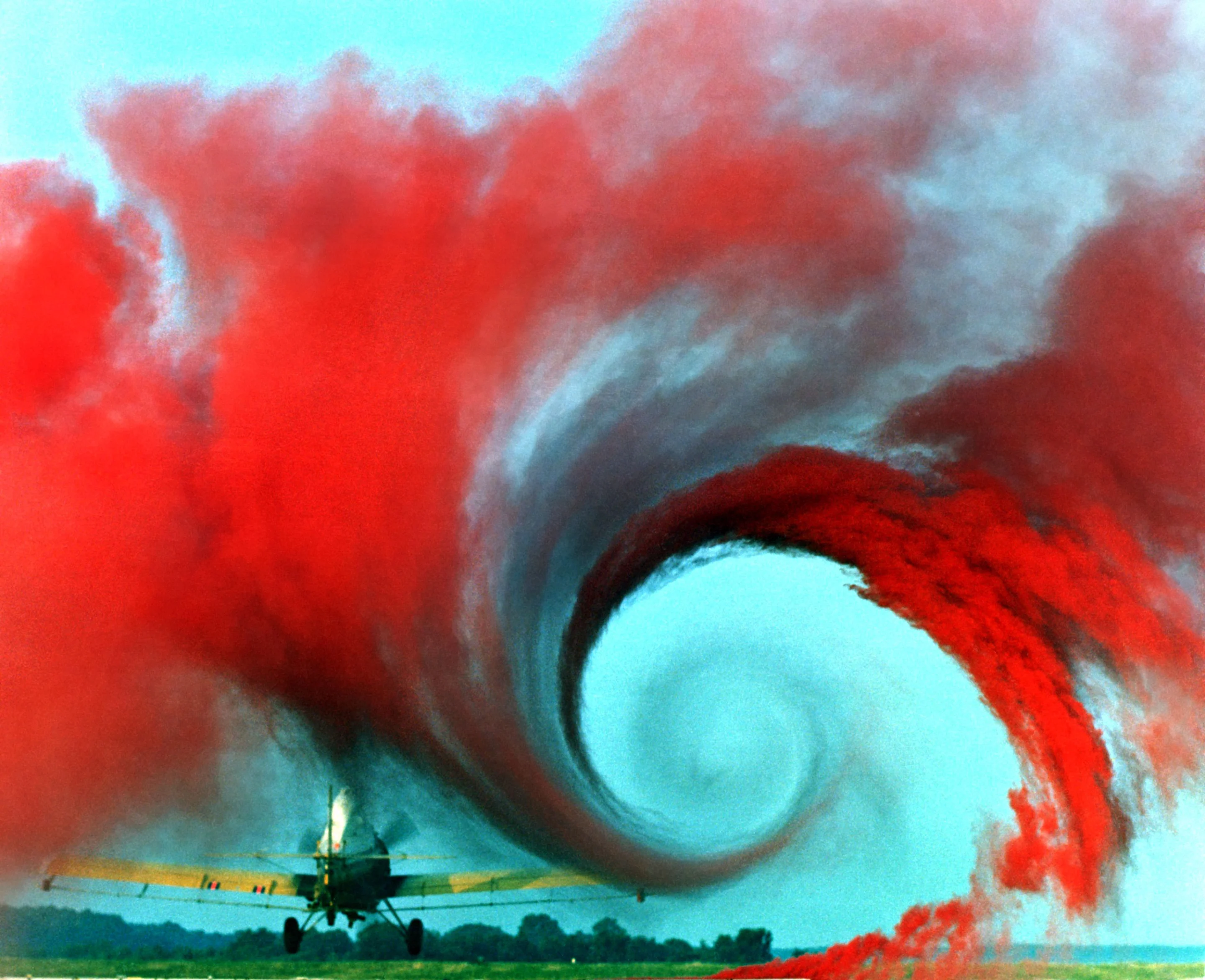 Airplane creating vortices made visible by colored smoke (Image: NASA Langley Research Center )