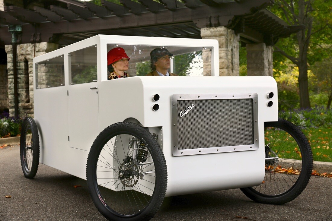 Both front seat occupants power the vehicle by pedalling
