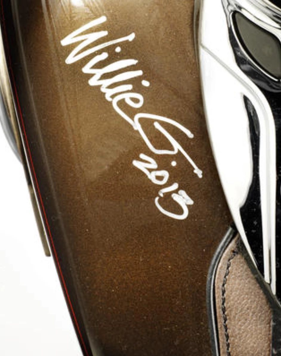 The Harley is also signed by Willie G." Davidson, former senior vice president & chief styling officer of Harley-Davidson Motor Company