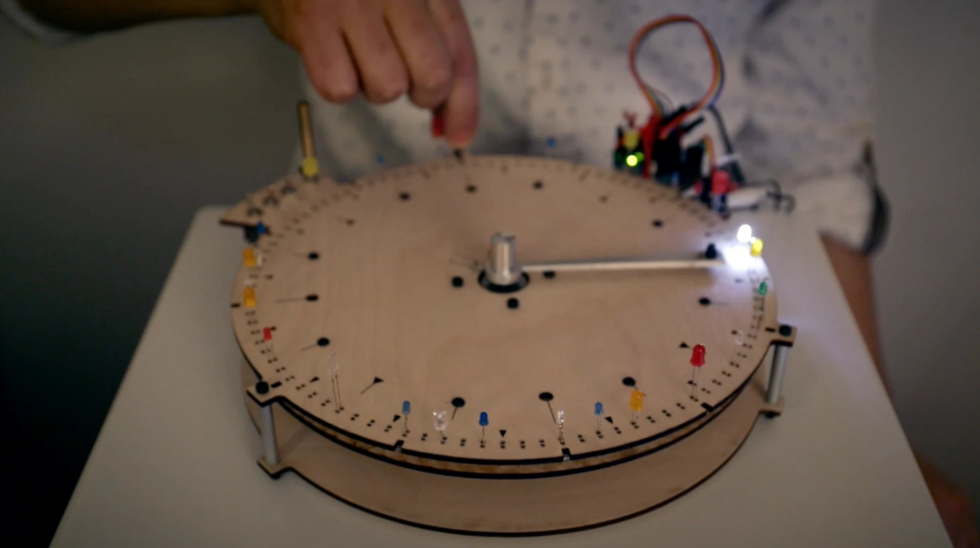 The sequence is set by popping in LEDs around the BlinkWheel's edge, and triggered when a rotating arm comes into contact with an LED's anode