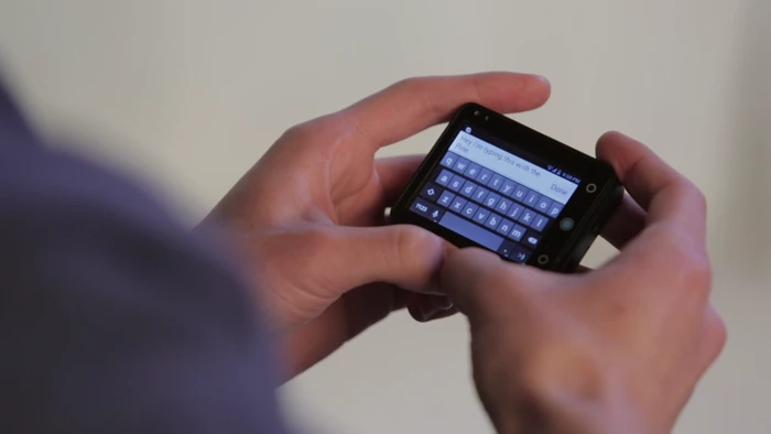 The Pine removes from the strap for two-thumb typing