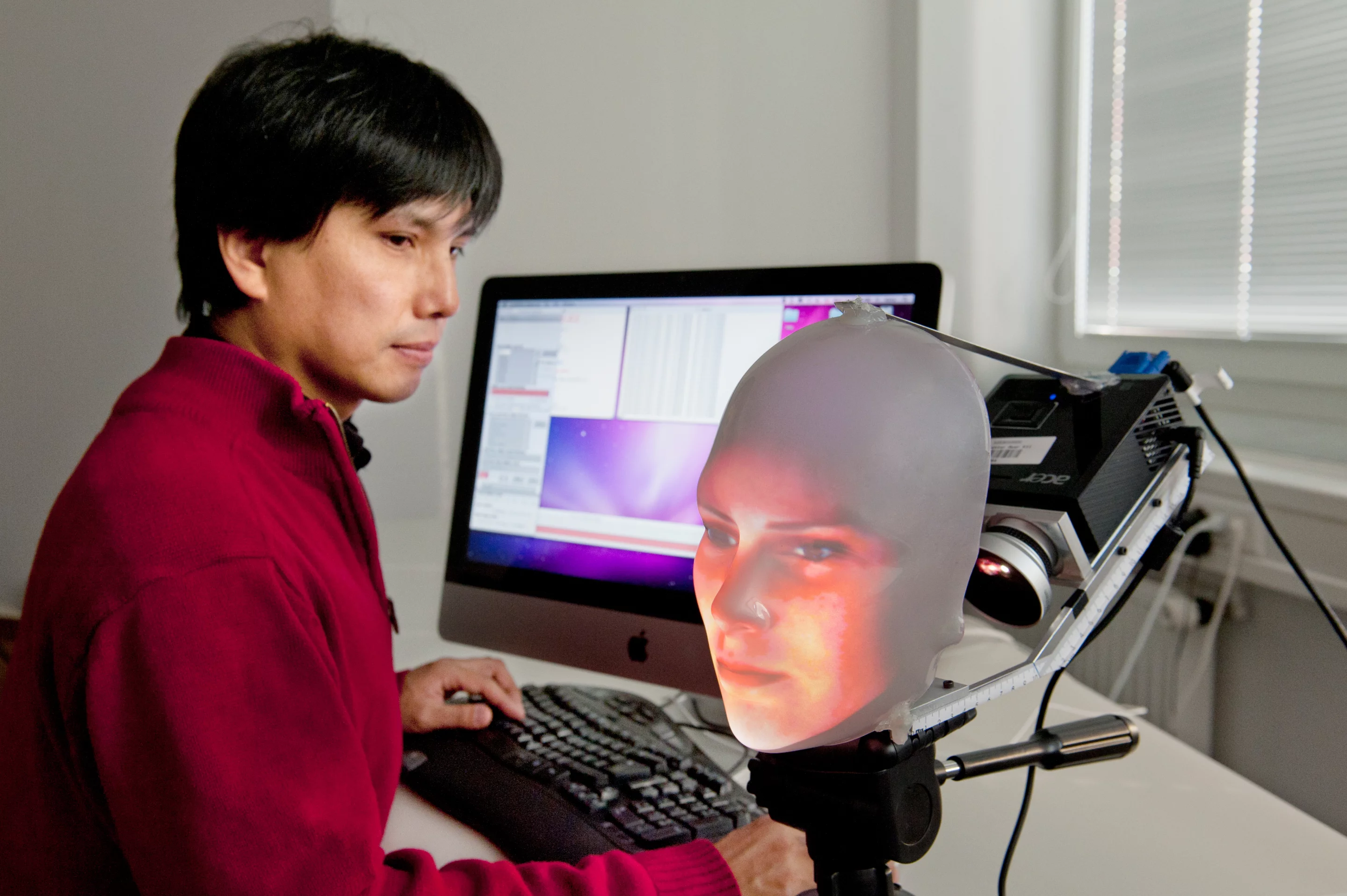 Dr. Takaaki Kuratate with Mask-bot