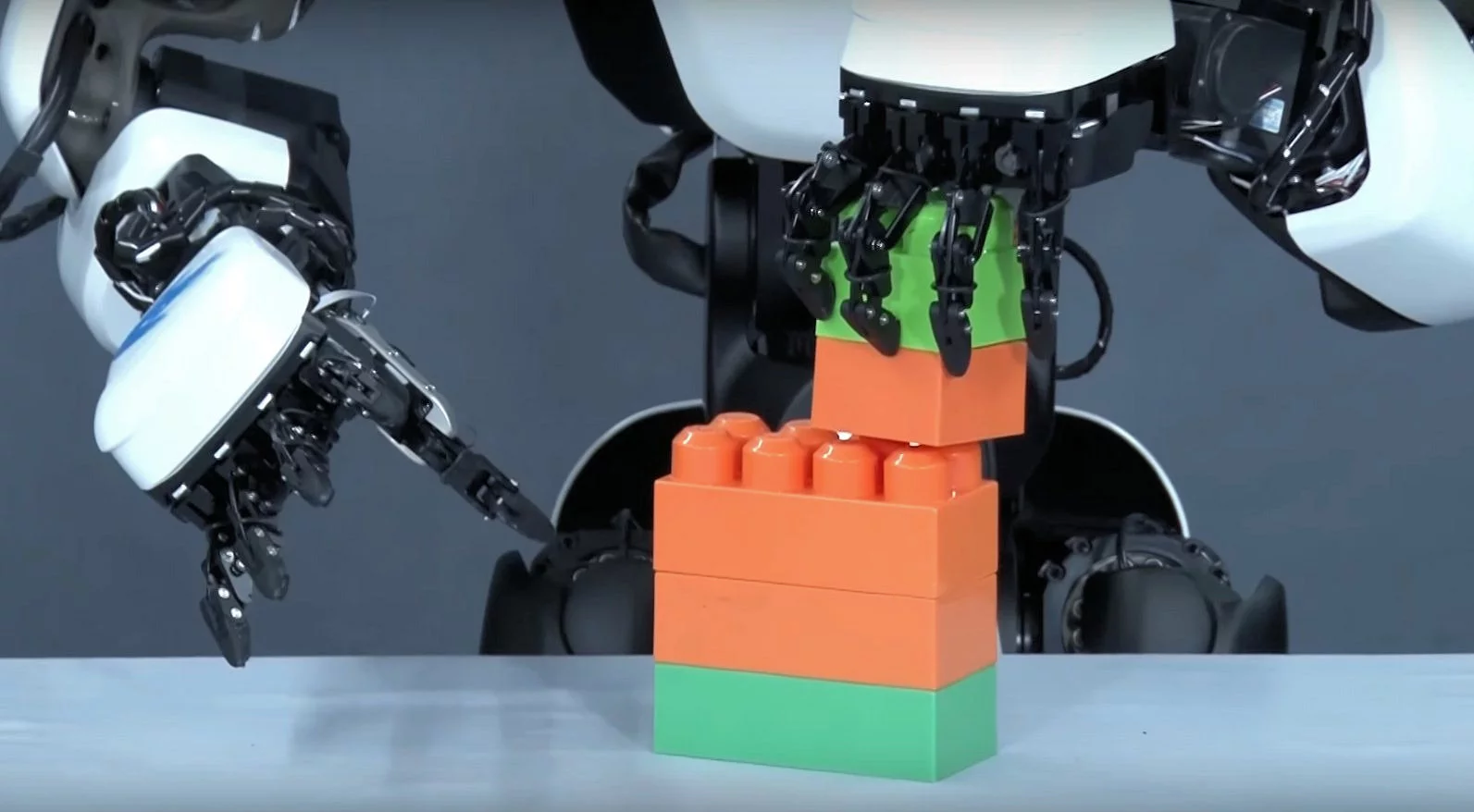 Force feedback from the T-HR3's 10-fingered hands ensures precise control of objects by the remote operator